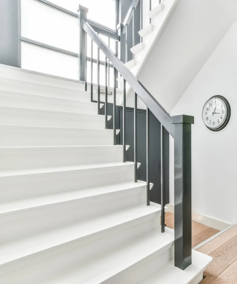 White staircase with black bannister